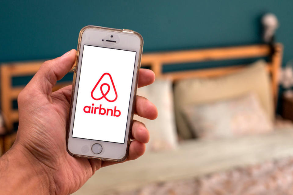 In this photo illustration, the Airbnb app seen displayed on a smartphone screen. 