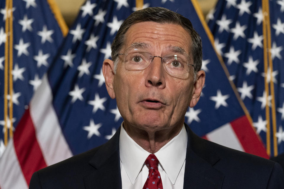 FILE - In this June 8, 2021, file photo, Sen. John Barrasso, R-Wyo., speaks with reporters after a Republican caucus luncheon on Capitol Hill in Washington. Barrasso said Friday, June 11, 2021, that U.S. Bureau of Land Management nominee Tracy Stone-Manning should be disqualified over her links to "extreme environmental activists" when Manning was a graduate student in the 1980s. (AP Photo/Alex Brandon, File)