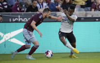 Colorado Rapids defender Danny Wilson, left, and San Jose Earthquakes forward Jeremy Ebobisse compete for control of the ball during the first half of an MLS soccer match Saturday, June 3, 2023, in Commerce City, Colo. (AP Photo/David Zalubowski)