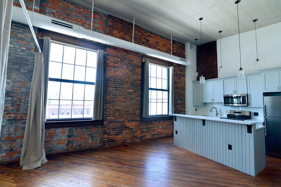 Several of the new apartments in the Updegraff building feature exposed brick walls. The developer, Blackthorn Capital Partners, tried to preserve the building's vintage features.