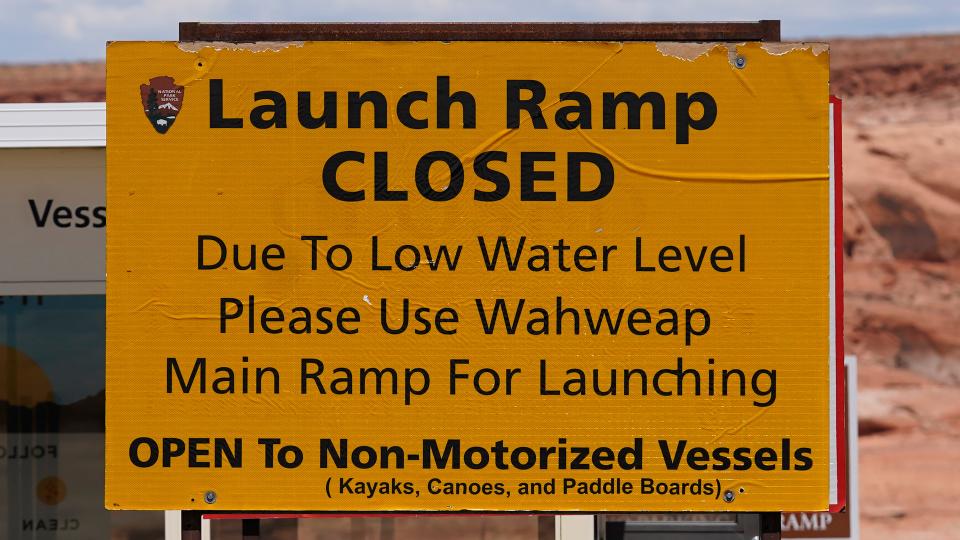 A "Launch Ramp Closed" sign is seen at the Antelope Point launch ramp on Lake Powell on July 31, 2021, near Page, Ariz.