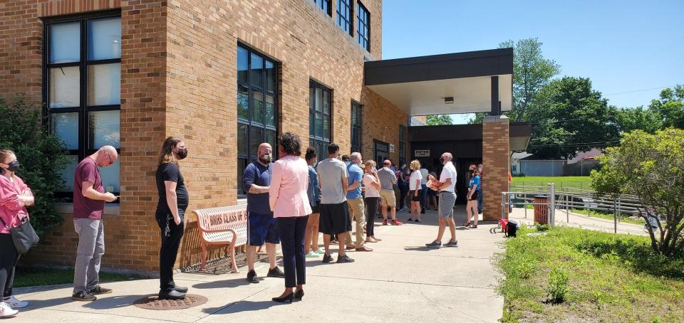 A long line forms at the Broad Ripple High School voting site on June 2 in Indianapolis. Some voters reported an hour wait time.