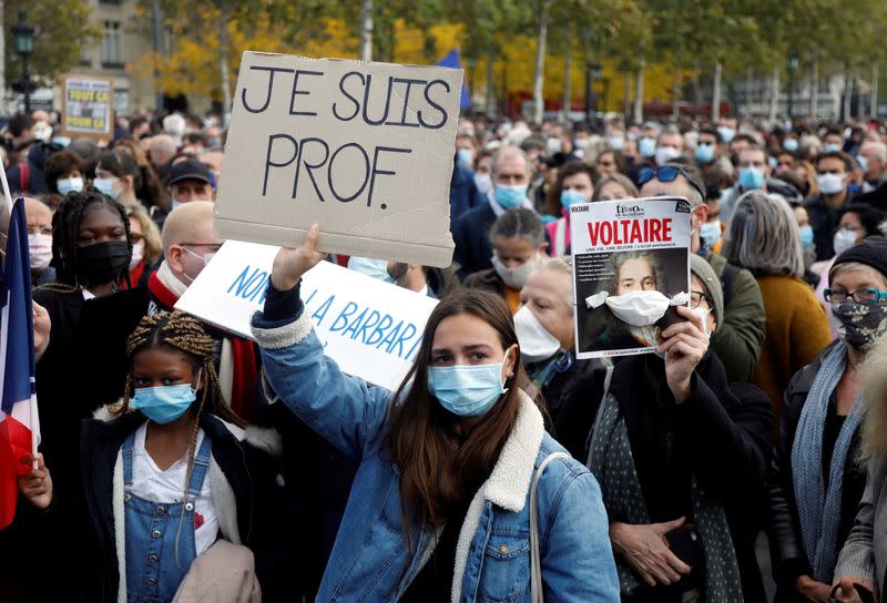 People pay tribute to beheaded teacher Samuel Paty in Paris