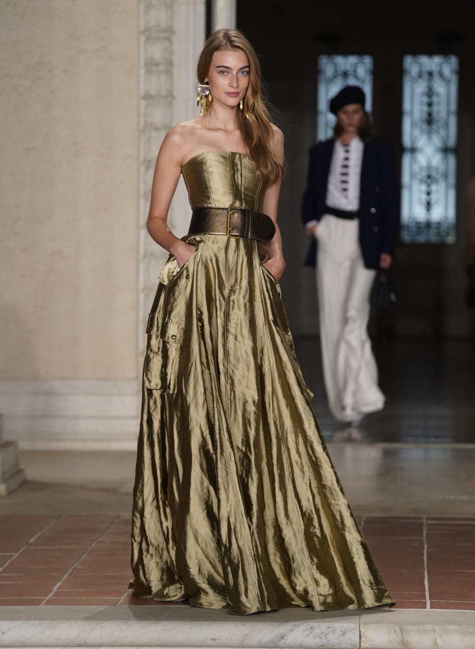 A model walks the runway at the Ralph Lauren Spring 2023 Fashion Experience on Thursday, Oct. 13, 2022, at The Huntington in Pasadena, Calif. (AP Photo/Chris Pizzello)