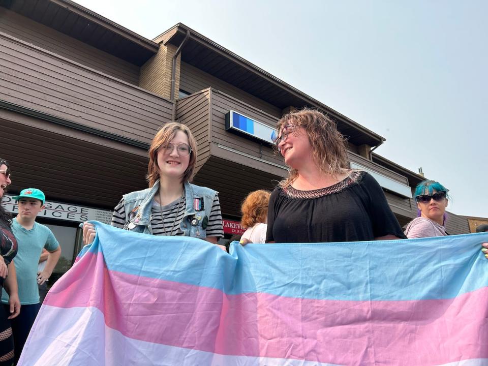 Wilbur Braidek, 14, and his mother, Jessica Fraser, were among hundreds of concerned people who rallied in Saskatoon on Sunday, Aug. 27, 2023, against the province's proposed policies on sexual education and pronoun use in schools. Those policies became law on Friday, Oct. 20, 2023. 