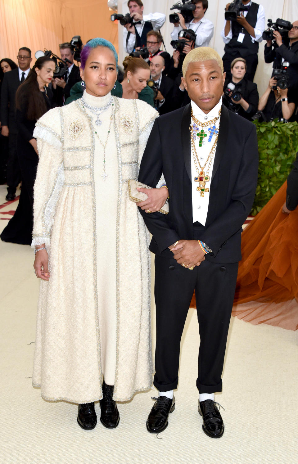 <p>Leave it to Pharell to rock the theme. The singer opted for a tuxedo by Chanel and accessorised the crisp white shirt with layered cross-bearing necklaces. <em>[Photo: Getty]</em> </p>