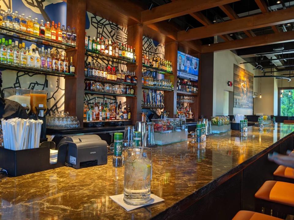 The new Outback Steakhouse store prototype includes a straight bar instead of a U-shape, shown at the Steele Creek store in Charlotte.