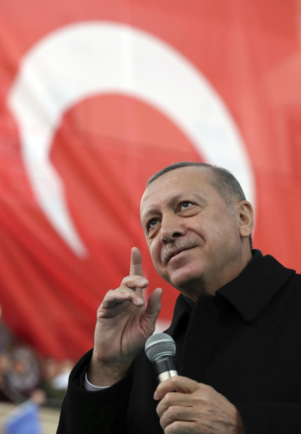 Turkey's President Recep Tayyip Erdogan addresses the supporters of his ruling Justice and Development Party, AKP, during a rally in Ankara, Turkey, Wednesday, March 13, 2019. Erdogan has laid in to Israeli Prime Minister Benjamin Netanyahu, calling him a "thief" and a "tyrant" in the latest spat between the two leaders.(Presidential Press Service via AP, Pool)