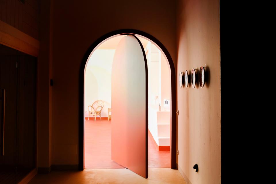 “The typical Menorca architecture, with round doors, the marès (a sandstone from the Balearic Islands), and the colors that can be seen in the town of Ciutadella de Menorca (such as dark red and dark green), characterized the spaces,” Dorothée says.