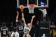 Stephen F. Austin forward Trinity Moore (33) shoots over California Baptist forward Emily Sewell (20) during the first half of an NCAA college basketball game in the championship of the Western Athletic Conference women's tournament Saturday, March 16, 2024, in Las Vegas. (AP Photo/David Becker)