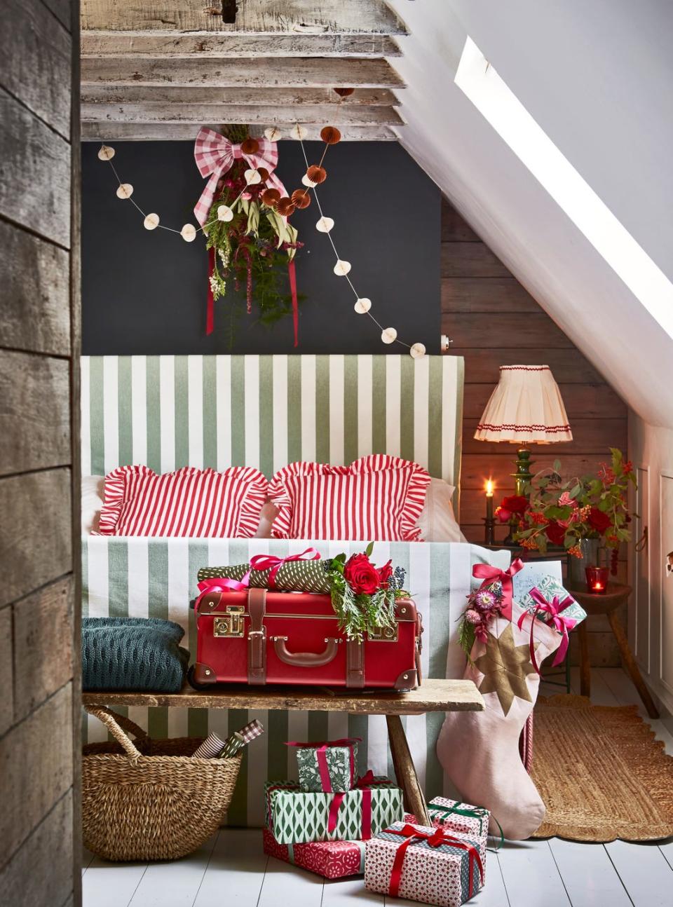 christmas bedroom with striped bed and presents