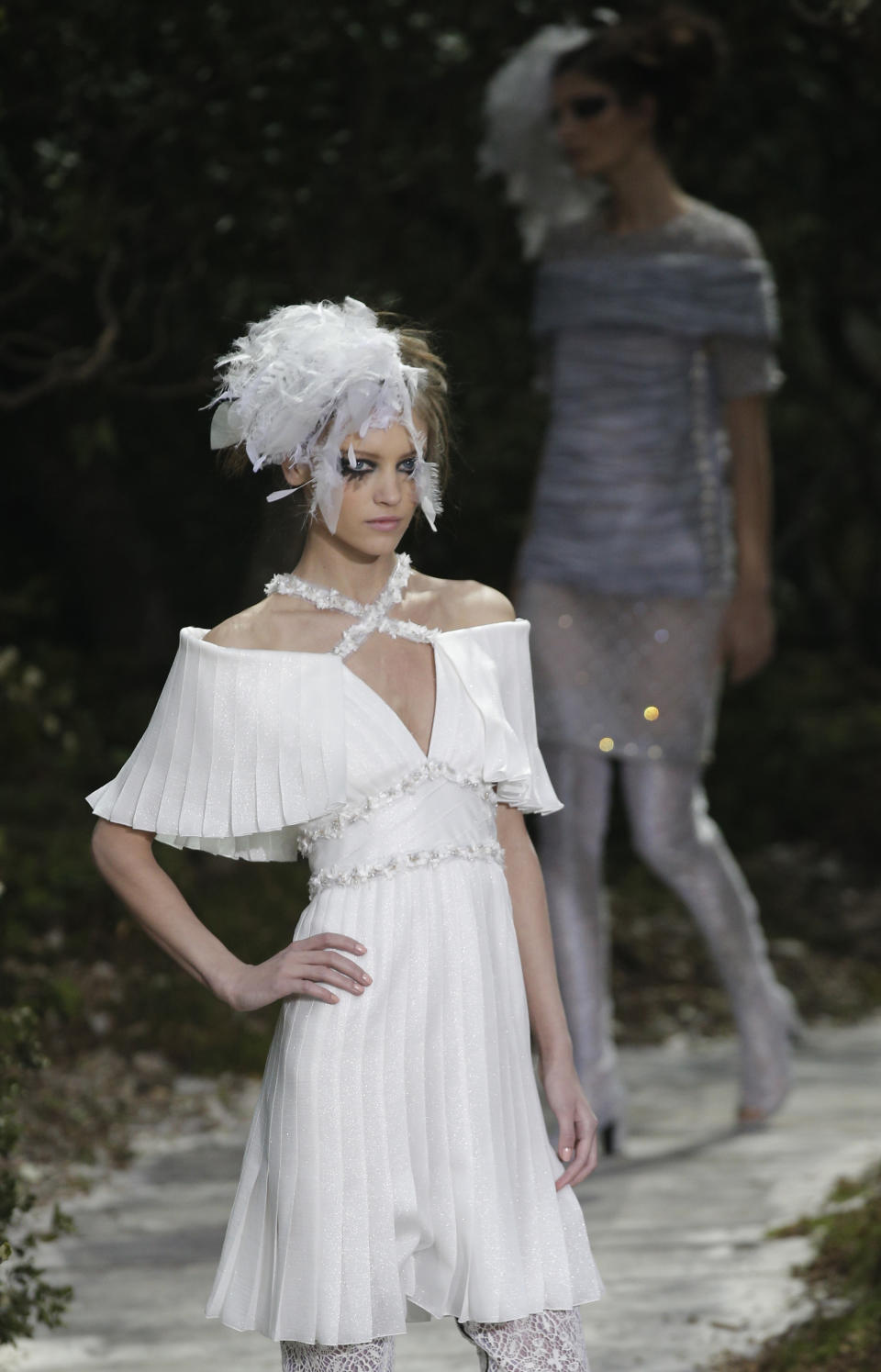 A model presents a creation by German fashion designer Karl Lagerfeld for Chanel's Spring-Summer 2013 Haute Couture fashion collection, presented in Paris, Tuesday, Jan.22, 2013. (AP Photo/Christophe Ena)