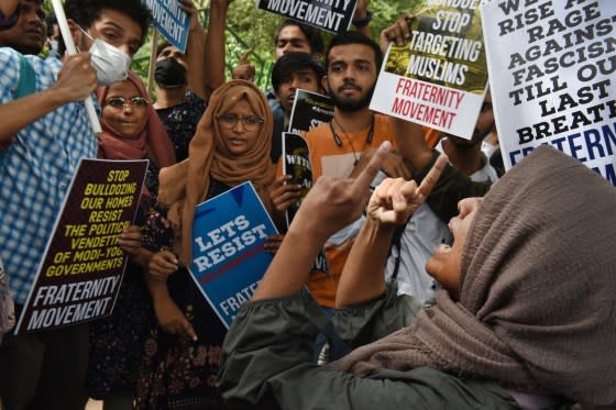 Demonstrators hold placards against the demolition of the house of activist Afreen Fatima and her father Javed Mohammad on June 13, 2022 in Delhi.<span class="copyright">Ajay Aggarwal—Hindustan Times/Getty Images</span>