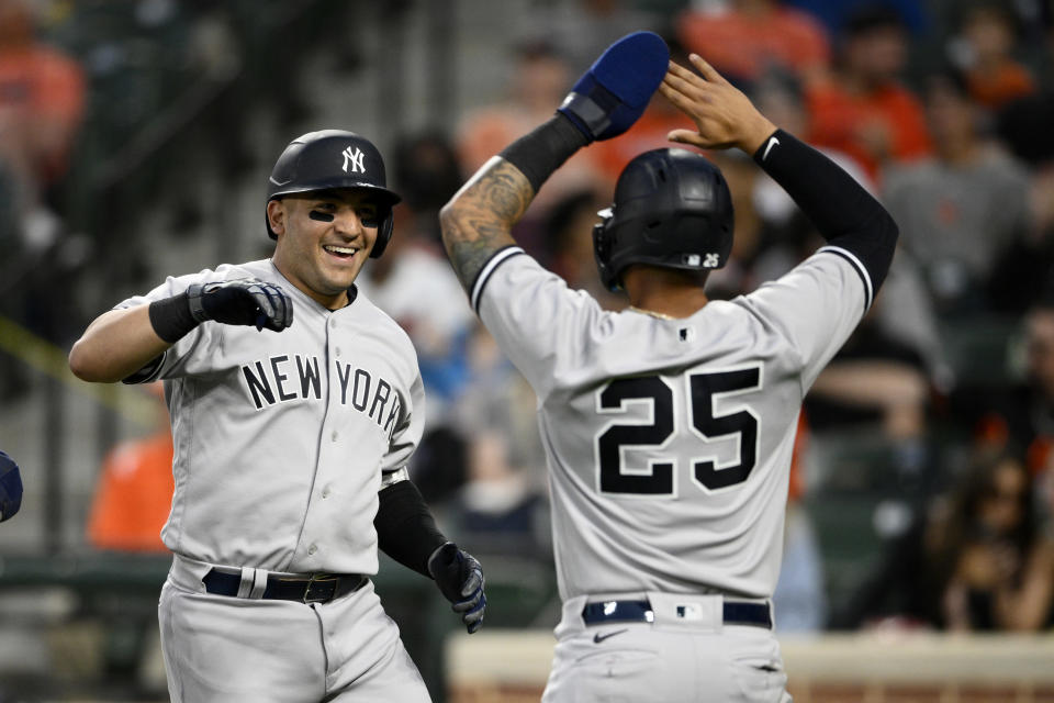 New York Yankees' Jose Trevino, left, celebrates his three-run home run with teammate Gleyber Torres (25) during the fourth inning of a baseball game against the Baltimore Orioles, Monday, May 16, 2022, in Baltimore. (AP Photo/Nick Wass)