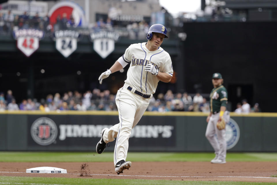 Seattle Mariners' Kyle Seager rounds the bases on his two-run home run against the Oakland Athletics in the first inning of a baseball game Sunday, Sept. 29, 2019, in Seattle. (AP Photo/Elaine Thompson)