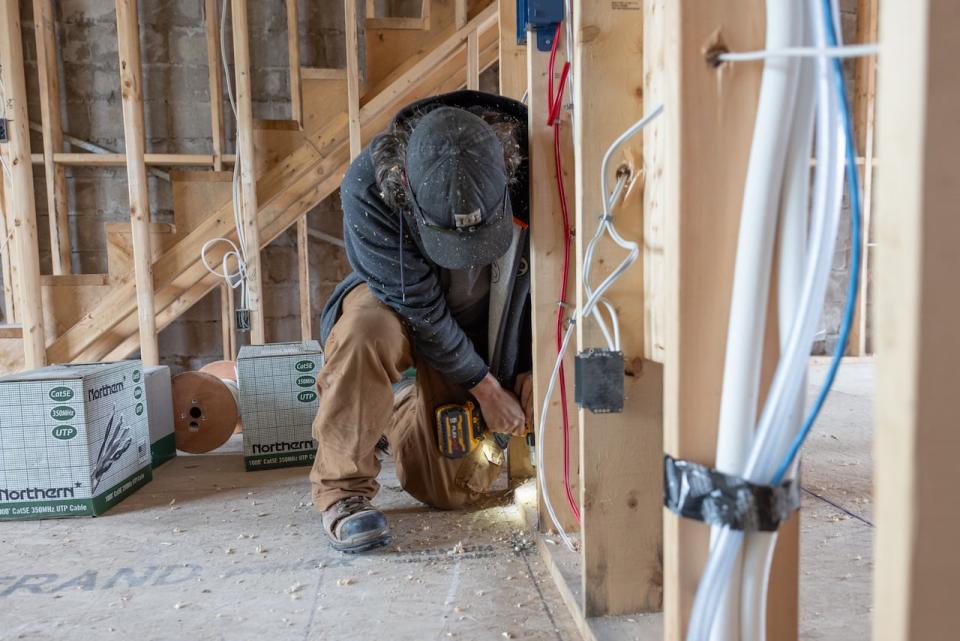 New construction sites in Halifax. Workers tear down safety railings on a Multi storey condo along Joseph Howe Drive. New single and semi detached housing   in Beechville, NS.