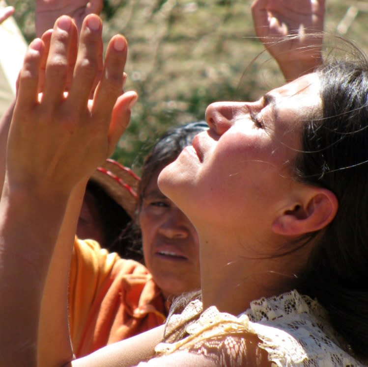 In this July 25, 2012 photo provided by the University of New Mexico, Tonita Gonzales, a curandera, or traditional Mexican folk healer, prays during a ceremony at the University of New Mexico during a workshop on curanderismo. The Maxwell Museum of Anthropology in Albuquerque, N.M. is scheduled to host an exhibit this summer on curanderismo and will invite healers from Latin America to give talks on a traditional healing field that is growing in the United States thanks to immigration from Latin America. (AP Photo/Courtesy of the University of New Mexico)