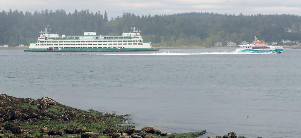 FILE — The Washington State Ferry Kaleetan and Kitsap Transit's fast-ferry the Lady Swift pass in Rich Passage off the shore of Manchester State Park in August 2020.