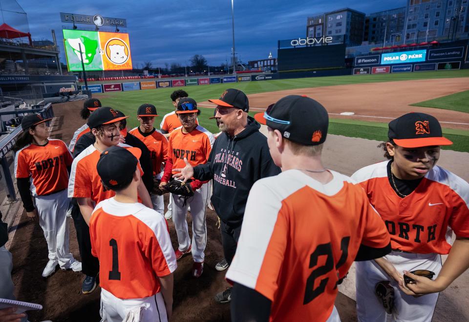 North High baseball coach Mark Goodridge talks to the team before playing Burncoat at Polar Park on Monday April 8, 2024.