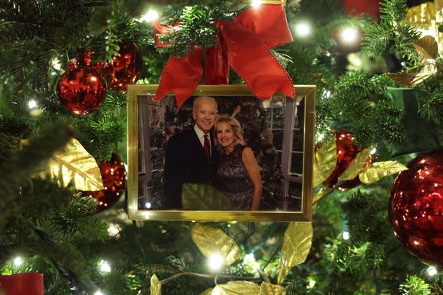 WASHINGTON, DC - NOVEMBER 29:  An ornament of a portrait of U.S. President Joe Biden and first lady Jill Biden is hung on a Christmas Tree in the State Dining Room of the White House during a press preview of the holiday decorations November 29, 2021 in Washington, DC. The 2021 White House holidays theme is “Gifts from the Heart.” A variety of interactive viewing experiences will be launched on digital platforms, including Instagram, Google Maps Street View, Snapchat, and others that will allow the public to engage with the White House from home over the course of holidays. (Photo by Alex Wong/Getty Images) (Photo: Alex Wong via Getty Images)