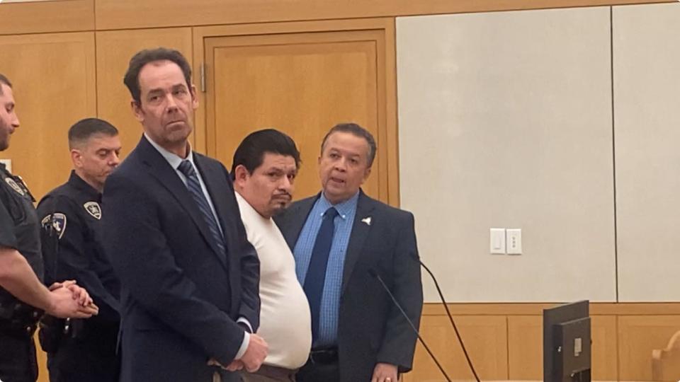 Antonio Robles-Sanchez, standing between his lawyer and a Spanish interpreter, in Westchester County Court Feb. 15, 2024, for his arraignment on charges including 2nd-degree vehicular manslaughter in the Aug. 26, 2023, death of Stephanie Kavourias in Greenburgh.