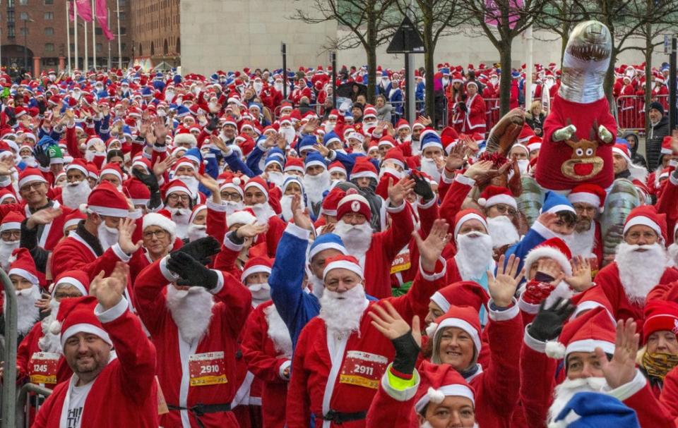 Participants taking part in the Liverpool Santa Dash in Liverpool in aid of Alder Hey Children’s Hospital (Jason Roberts/PA) (PA Wire)