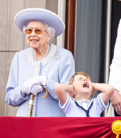 <p>Samir Hussein/WireImage</p> Queen Elizabeth and Prince Louis on the balcony of Buckingham Palace during Trooping the Colour in June 2022.