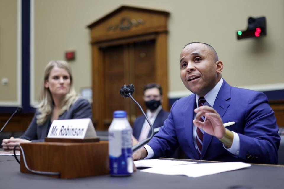 Former Facebook employee Frances Haugen and president of Color of Change Rashad Robinson testify during a Capitol Hill hearing before the Communications and Technology Subcommittee of House Energy and Commerce Committee on Dec. 1.