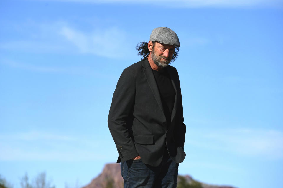 Troy Kotsur, nominated for an Oscar for best supporting actor for his role in the film "CODA," poses for a photo at Red Rock Park in Mesa, Ariz., on Jan. 28, 2022. (AP Photo/Matt York)