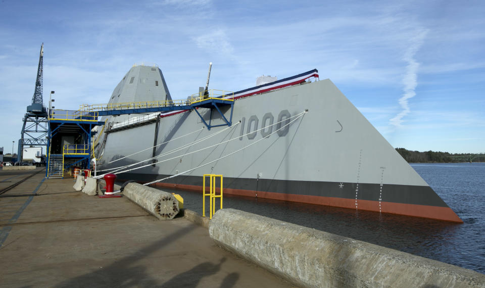 FILE - In a Thursday, Oct. 31, 2013 file photo, the Navy's stealthy Zumwalt destroyer is moored at Bath Iron Works, in Bath, Maine. The skipper of the technology-laden Zumwalt is Capt. James Kirk, and his futuristic-looking vessel sports cutting-edge technology, new propulsion and powerful armaments, but this ship isn’t the Starship Enterprise. The technology-laden Zumwalt taking shape at Maine’s Bath Iron Works is unlike any other U.S. warship. (AP Photo/Robert F. Bukaty, File)