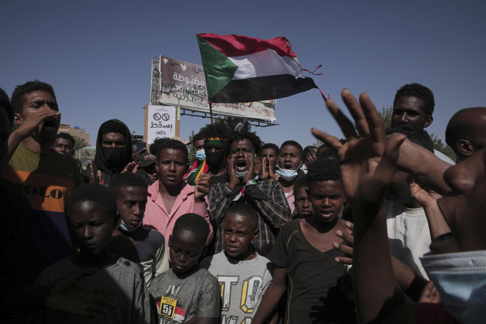 Thousands of protesters take to the streets to renew their demand for a civilian government in the Sudanese capital Khartoum, Thursday, Nov. 25, 2021. The rallies came just days after the military signed a power-sharing deal with the prime minister, after releasing him from house arrest and reinstating him as head of government. The deal came almost a month after the generals orchestrated a coup. Sudan’s key pro-democracy groups and political parties have dismissed the deal as falling short of their demands for a fully civilian rule. (AP Photo/Marwan Ali)