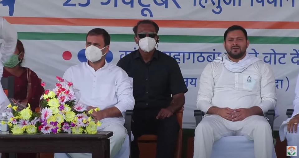 Tejashwi Yadav could be seen without a mask next to Gandhi.