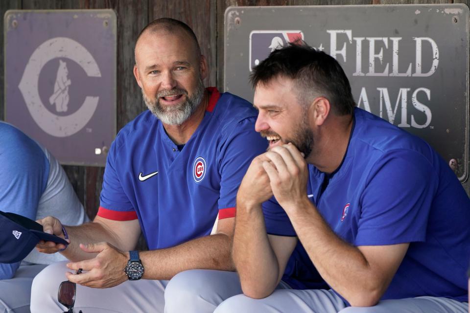 Chicago Cubs manager David Ross, left, talks with Wade Miley, right, before a baseball game against the Cincinnati Reds at the Field of Dreams movie site, Thursday, Aug. 11, 2022, in Dyersville, Iowa. (AP Photo/Charlie Neibergall)