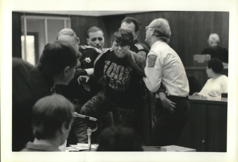 Rita Isbell, older sister of Errol Lindsey, shouts at Jeffrey L. Dahmer after she addressed the court in 1992.