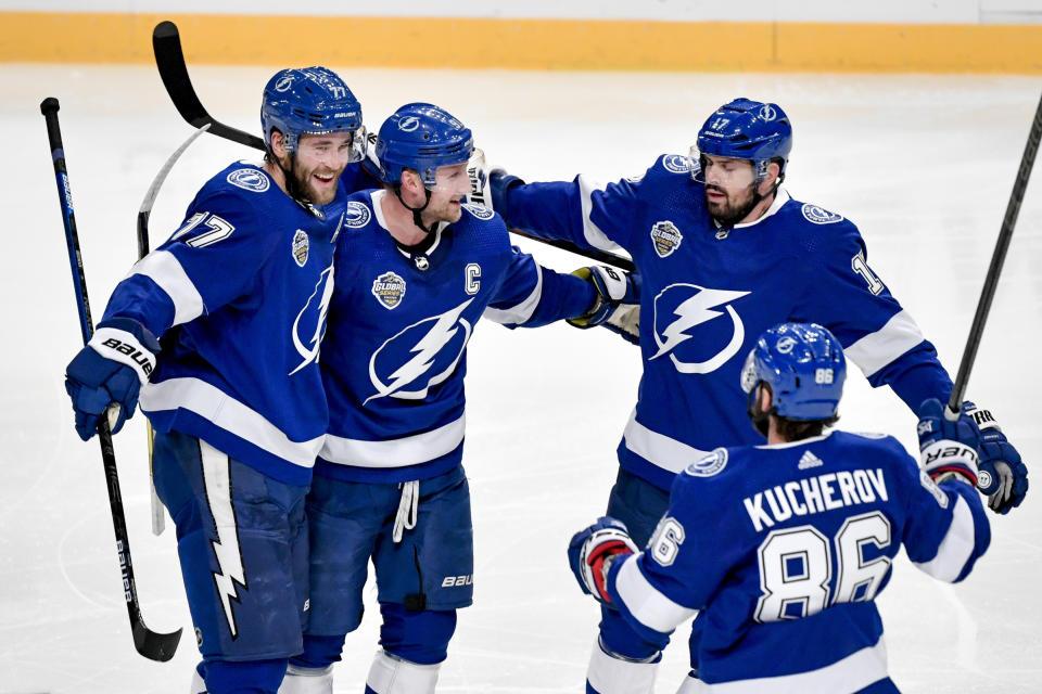 Tampa celebrates after Victor Hedman, left, scored, during a NHL Global Series hockey match between the Buffalo Sabres and Tampa Bay Lightning at the Globen Arena, in Stockholm Sweden, Saturday, Nov. 9, 2019. (Jessica Gow/TT News Agency via AP)