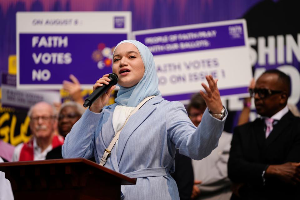 Poet Sara Abou Rashed speaks during a gathering of Columbus faith leaders speaking out against Issue 1 in a “Faith Votes No” rally at Washington Gladden Social Justice Park downtown.