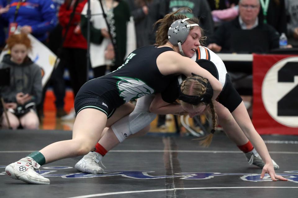 Harrison's Raegan Briggs and Delaware Hayes' Hailey Hatfield compete in their 115-pound match during the OHSWCA Girls State Wrestling Tournament on Feb. 19, 2022, at Hilliard Davidson High School in Hilliard, Ohio.