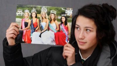 Olivia O'Neil holds up a photo of her short reign as a blond Miss Teen Wanganui (center). Photo courtesy of New Zealand Herald