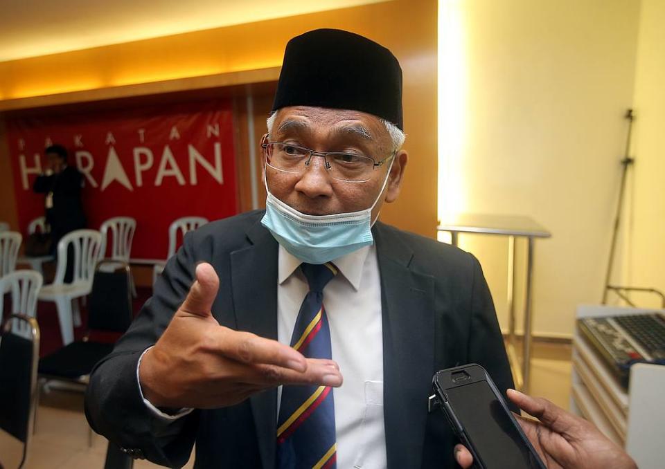 Perak Opposition Leader Abdul Aziz Bari talks to the press at the DAP Perak office in Ipoh December 4, 2020. — Picture by Farhan Najib