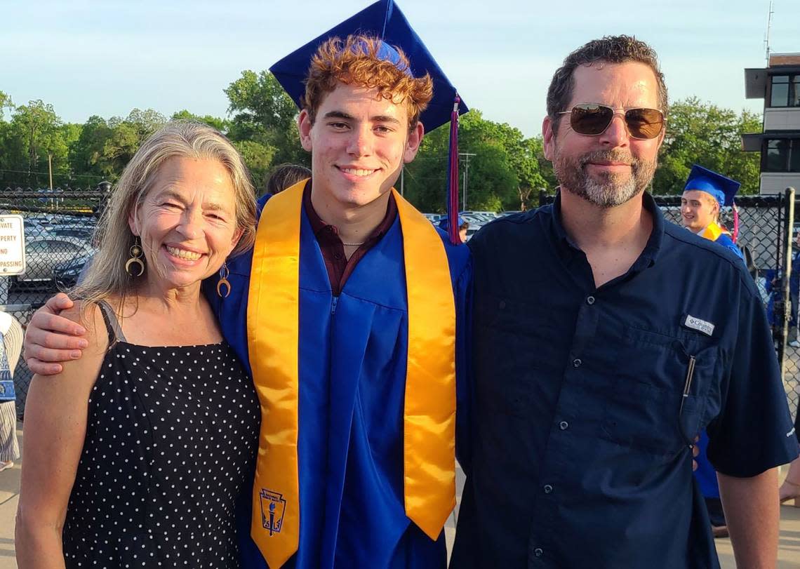 Grant Nicely with his parents at his graduation from Bishop Miege High School