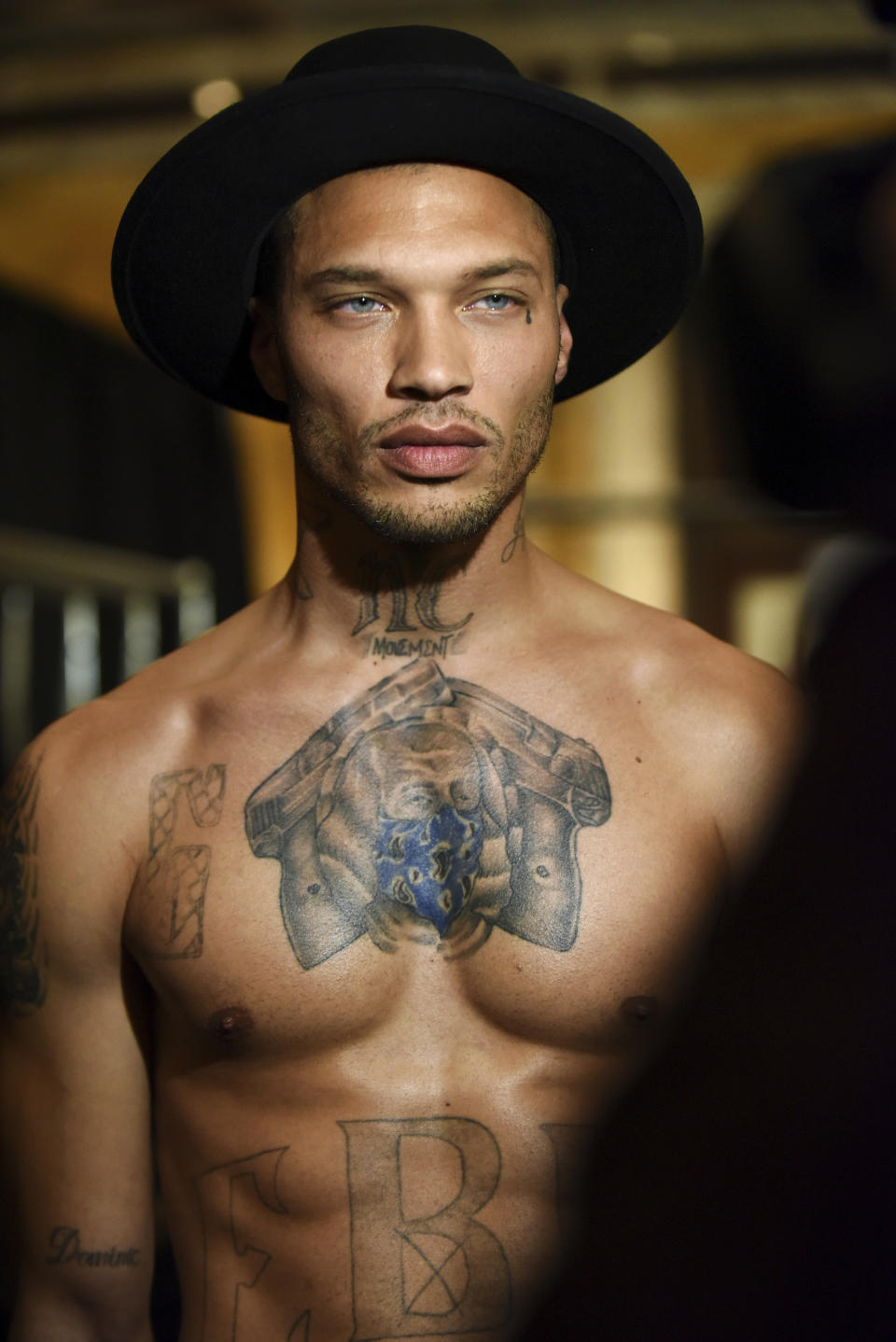 Jeremy Meeks, the model who was referred to as "the hot felon," poses backstage before the Philipp Plein fashion show, Monday, Feb. 13, 2017, in New York. (AP Photo/Diane Bondareff)