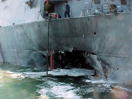 FILE PHOTO: The port side damage to the guided missile destroyer USS Cole is pictured after a bomb attack during a refueling operation in the port of Aden in this October 12, 2000 file photo. REUTERS/Aladin Abdel Naby/File Photo