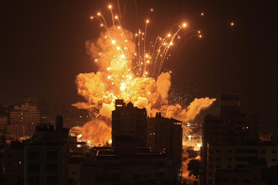 A missile explodes in Gaza City during an Israeli air strike on Sunday. Israel, reeling from the deadliest attack on its territory in half a century, formally declared war on Hamas Sunday as the conflict's death toll surged close to 1,000 after the Palestinian militant group launched a massive surprise assault from Gaza.