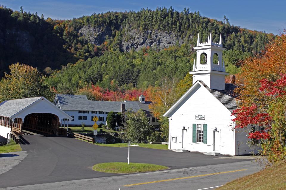 Stark Union Church (Stark, New Hampshire)
Particularly when fall foliage is in full swing, Stark Union Church’s open bell tower, plus the adjacent covered bridge, frames the landscape beautifully and its emerald-green shutters evoke a storybook setting.