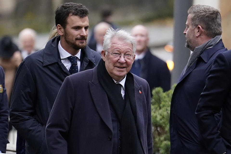 FILE - Alex Ferguson former manager of Manchester United arrives for the funeral of English soccer icon Bobby Charlton in Manchester, England, on Nov. 13, 2023. In 1990 Mark Robins scored a goal that has long-been credited for saving former Manchester United manager Alex Ferguson his job and provided the platform for more than two decades of success. Now Robins could push current United manager Erik ten Hag closer to the brink if he leads second division Coventry to a shock win in Sunday’s FA Cup semifinal. (AP Photo/Dave Thompson, File)