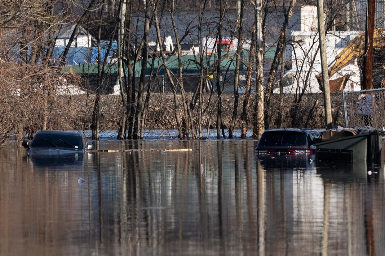 Jan 11, 2024; Paterson, NJ, USA; Cars are partially submerged on a flooded portion of East Holsman Street in Paterson, N.J. on Thursday. The rising Passaic River is expected to Thursday night.