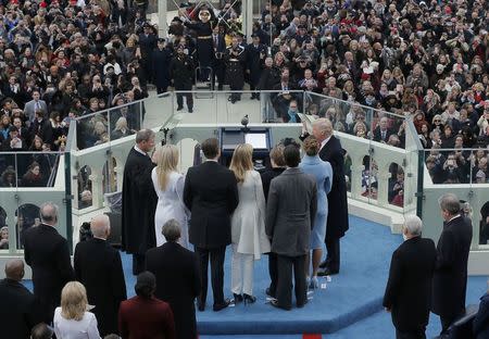 Donald Trump takes the oath of office as the 45th president of the United States during inauguration ceremonies on the West front of the U.S. Capitol in Washington, U.S., January 20, 2017. REUTERS/Brian Snyder