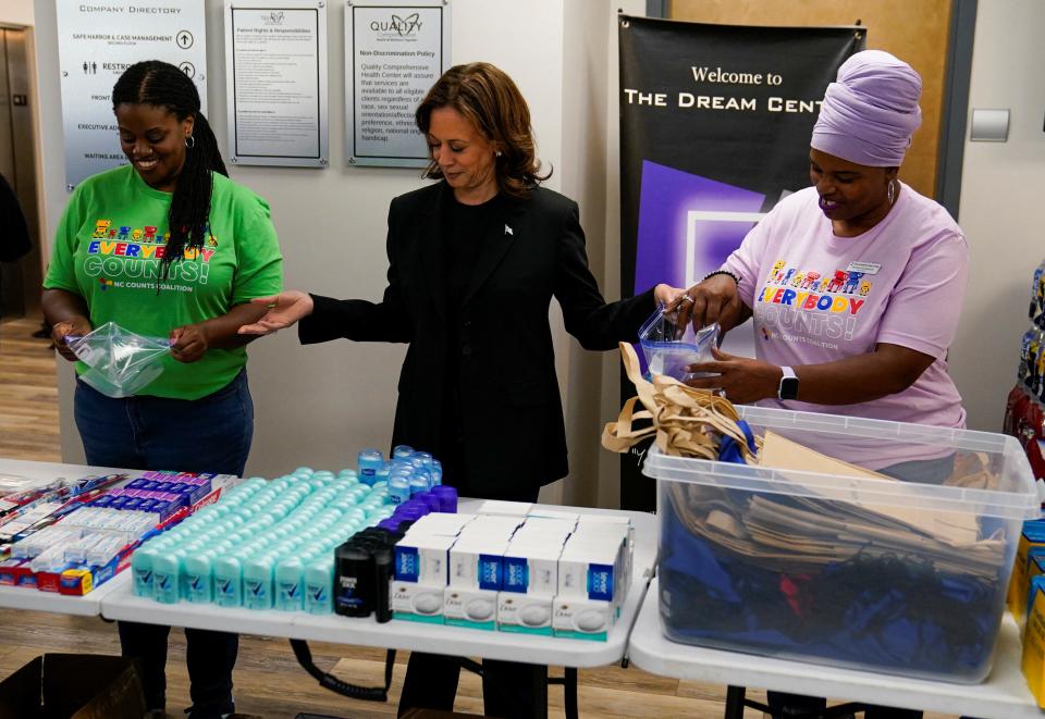 Vice President Kamala Harris, the Democratic presidential nominee, helps assemble emergency aid packages while meeting with volunteers at a resource donation center in Charlotte on Saturday.