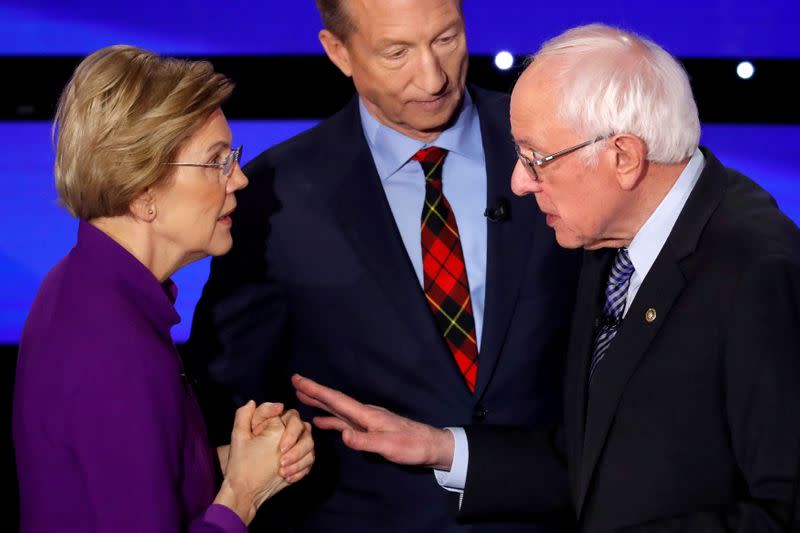 FILE PHOTO: Democratic 2020 U.S. presidential candidates Senator Elizabeth Warren (D-MA) speaks with Senator Bernie Sanders as billionaire activist Tom Steyer listens after the seventh Democratic 2020 presidential debate at Drake University in Des Moines