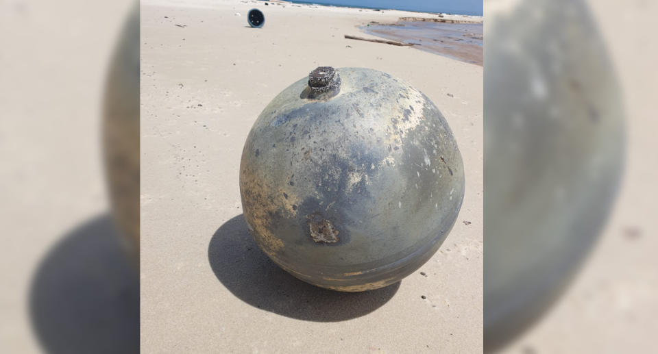 The spherical beach find looks is grey with considerable discolouration. 